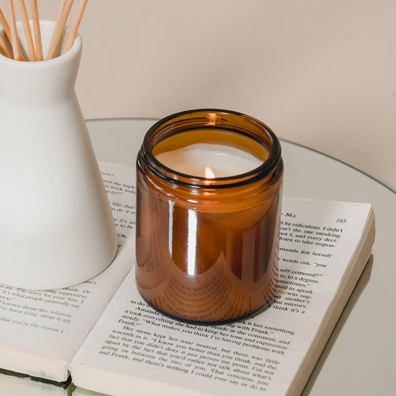 a filled decorative candle packaging with screw on lid 01