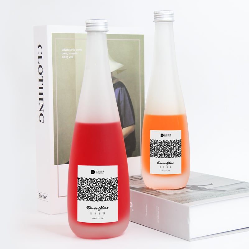 two labeled glass bottle packaging for beverages 02