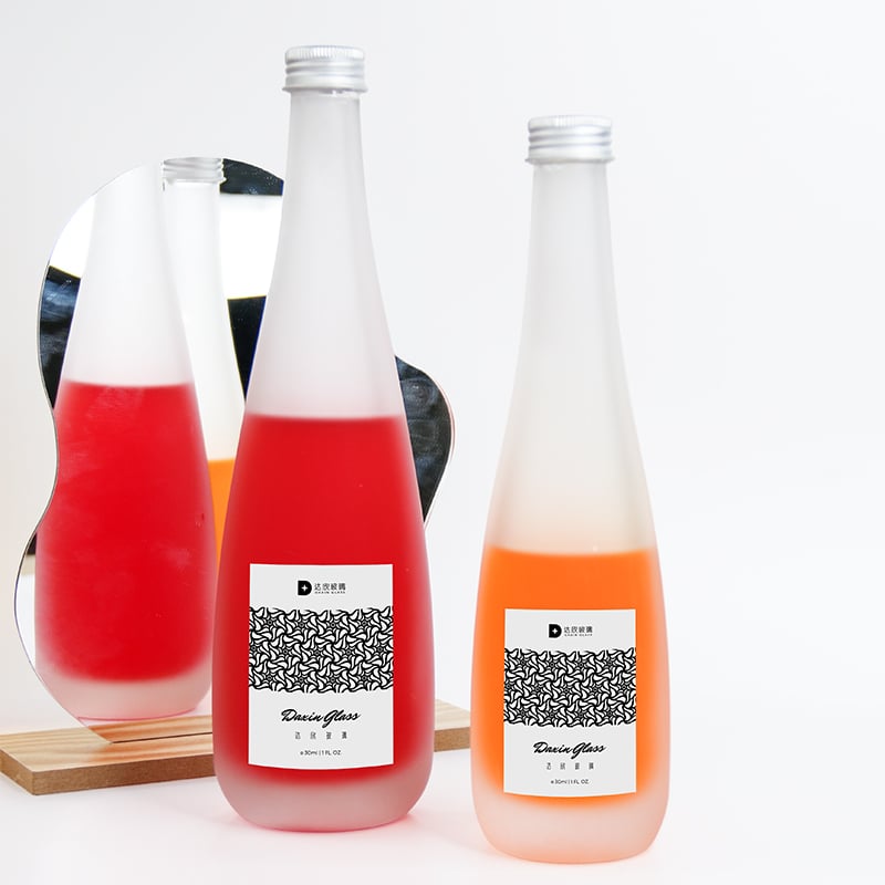 two labeled glass bottle packaging for beverages 01