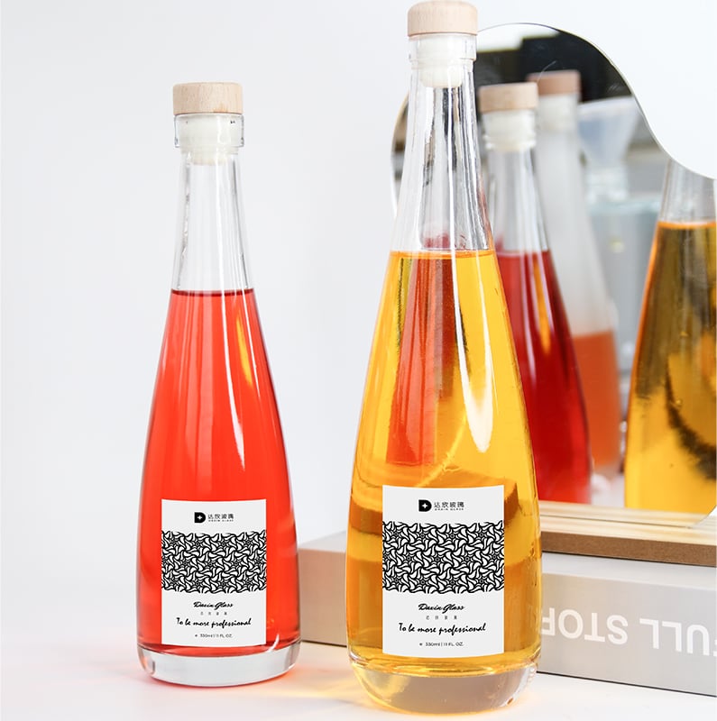 two labeled glass bottle packaging for beverages 05