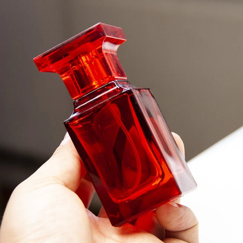 perfume glass bottle with red cap