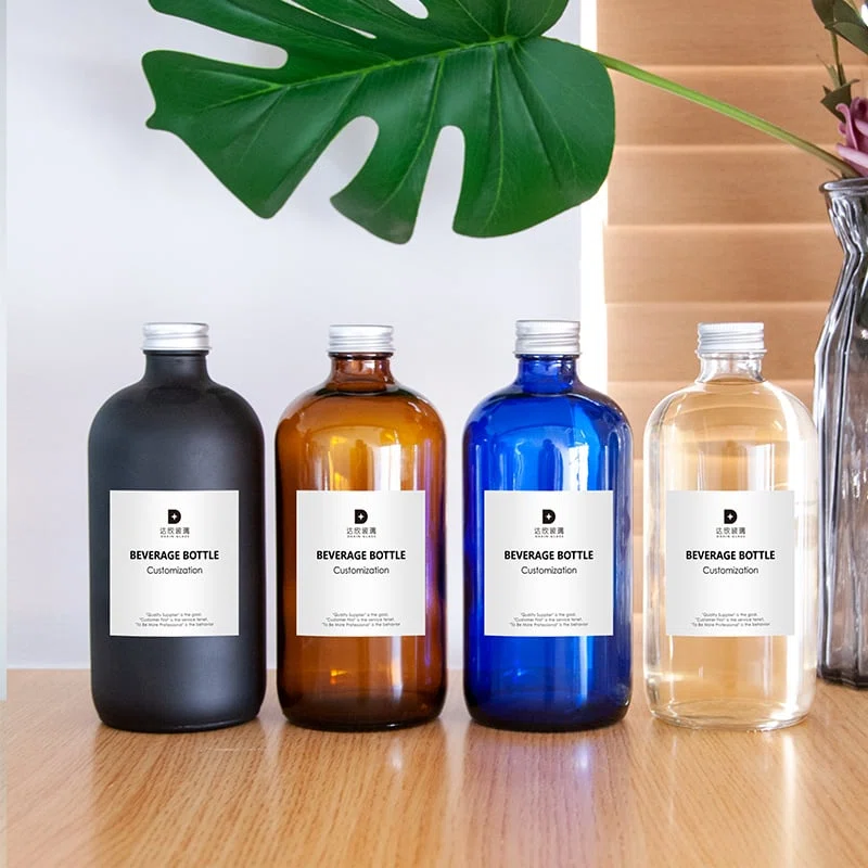four flexible custom glass bottle packaging for beverages with screwed on closure 01